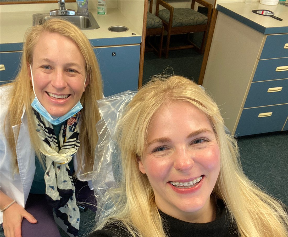 Rockwood Orthodontics patient smiling with ceramic braces alongside Dr. Schuler