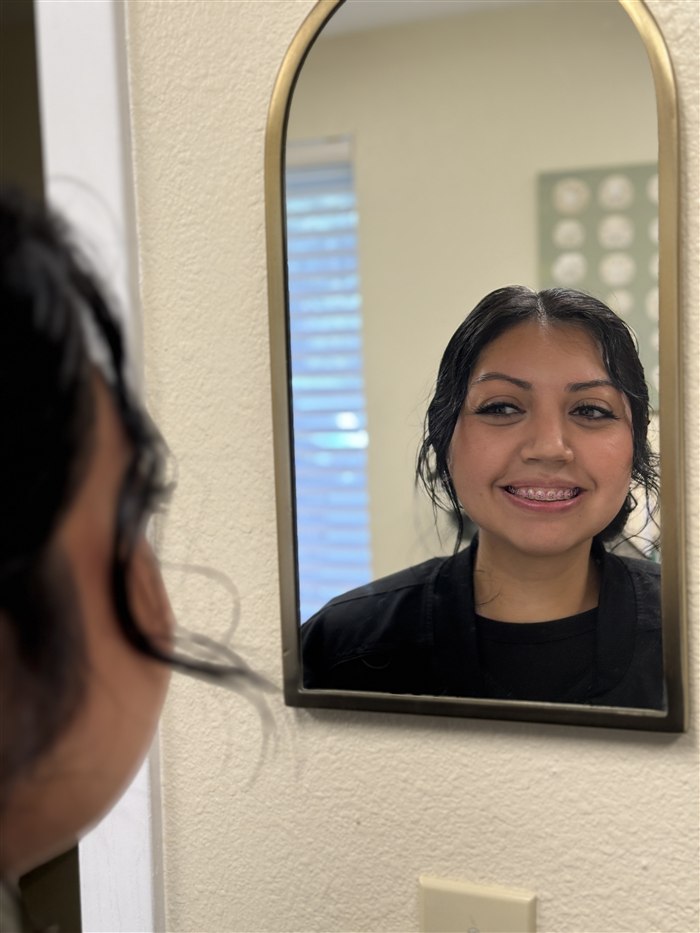 Smiling patient with braces at Rockwood Orthodontics