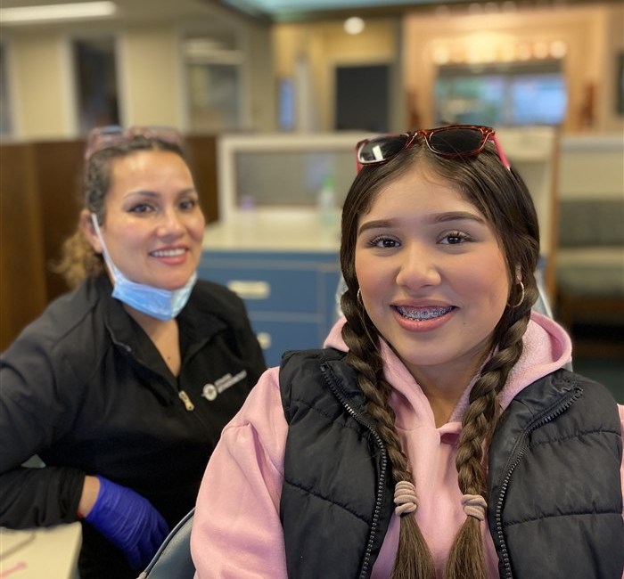 Rockwood Orthodontics staff member with a smiling patient